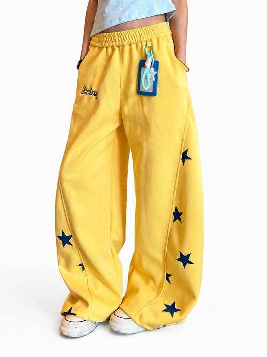 Ace Jolun yellow star graphic wide-leg sweatpants